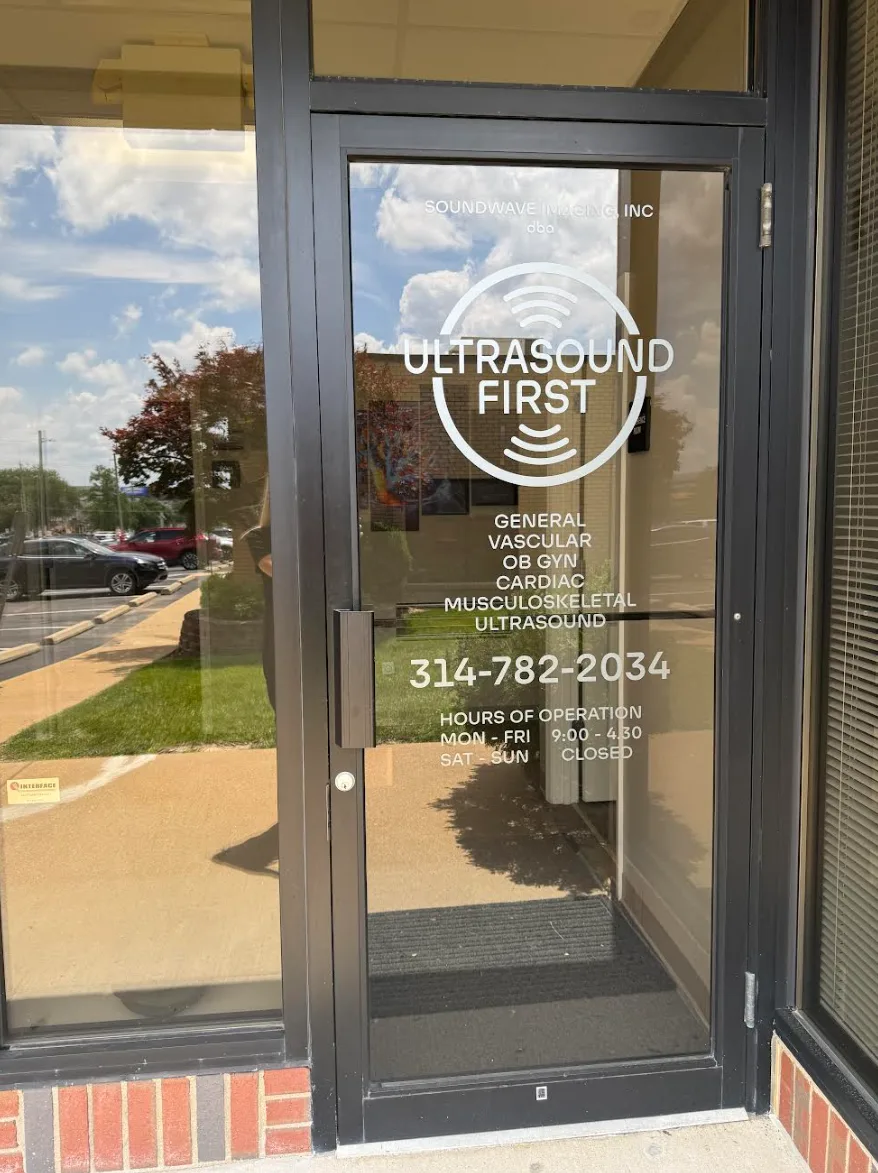 The glass entrance door with the Ultrasound First logo, services, phone number, and hours